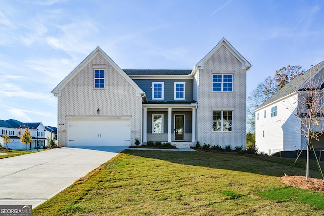 view of front facade featuring a front yard, a porch, and a garage