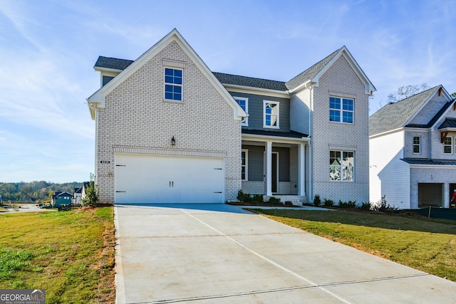 view of front of house featuring a front lawn, a porch, and a garage