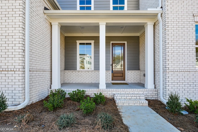 doorway to property featuring a porch