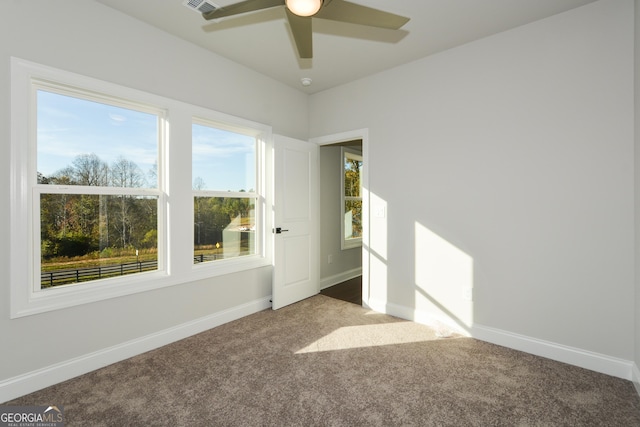 spare room with carpet and ceiling fan