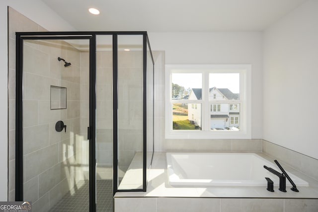 bathroom with independent shower and bath