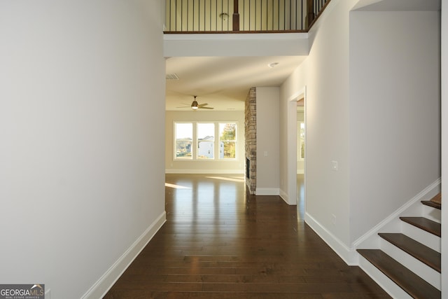 hall with dark wood-type flooring