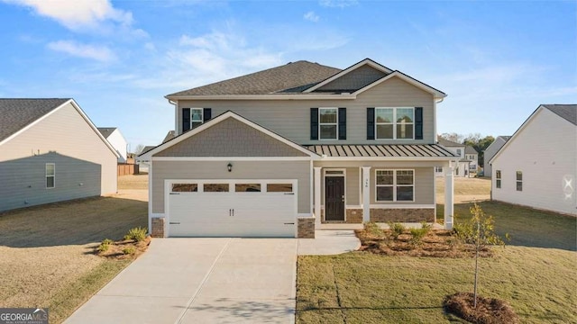 craftsman-style house featuring a garage and a front lawn