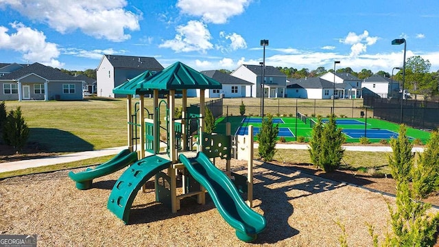 view of playground featuring a lawn