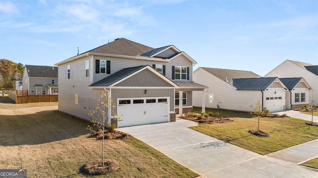 view of front of house with a front yard and a garage