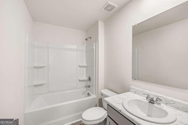 full bathroom featuring shower / bathing tub combination, vanity, and toilet