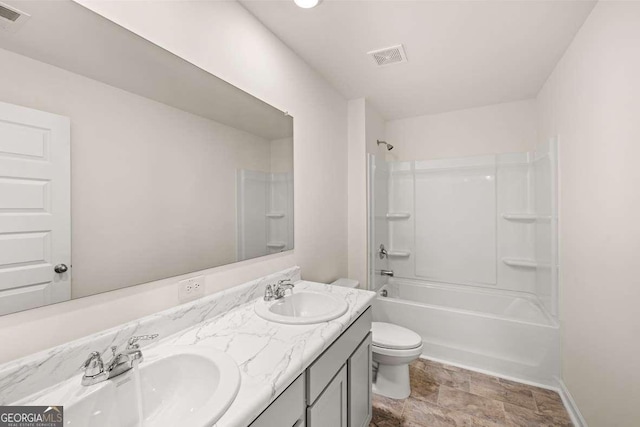 full bathroom with vanity, toilet, and bathtub / shower combination