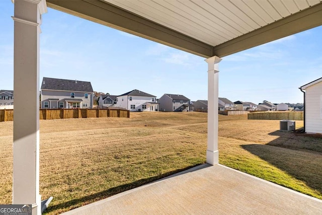 view of yard with cooling unit and a patio