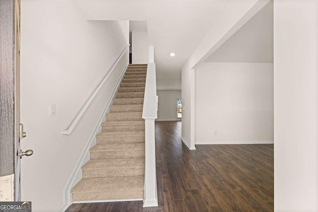 stairway with wood-type flooring