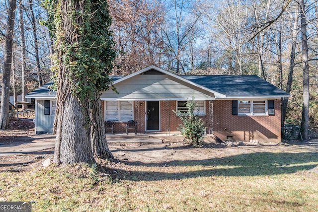 ranch-style home with a front lawn