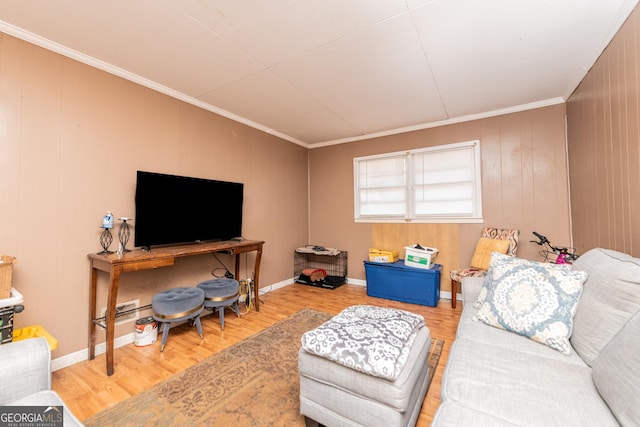 living room with hardwood / wood-style floors and ornamental molding