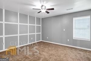 carpeted empty room with ceiling fan