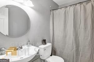 bathroom with toilet and sink