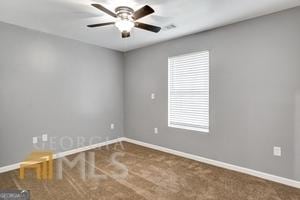 empty room featuring ceiling fan