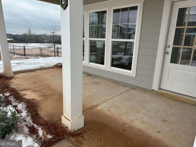 view of snow covered patio