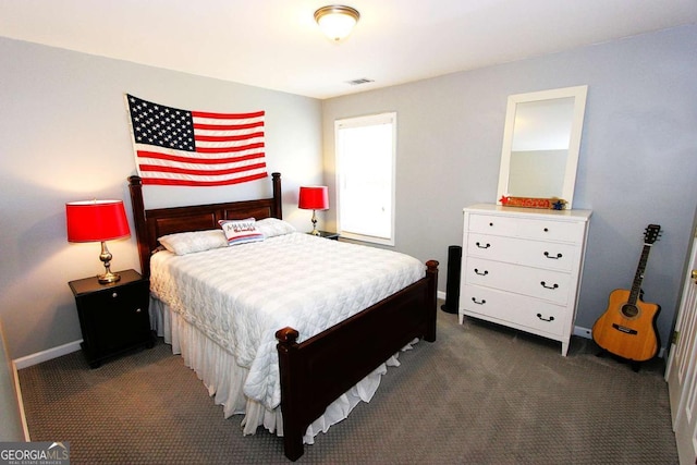 bedroom with dark carpet