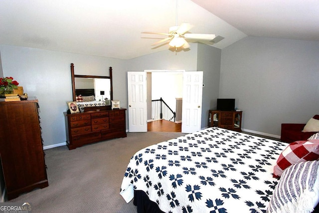 carpeted bedroom with ceiling fan and lofted ceiling