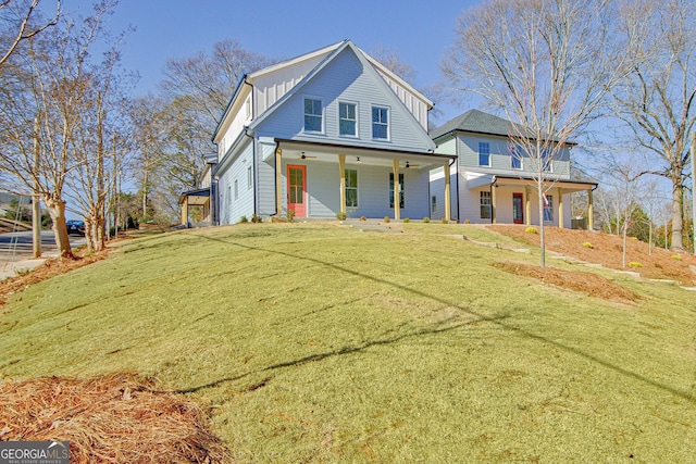 view of front of home featuring covered porch and a front lawn