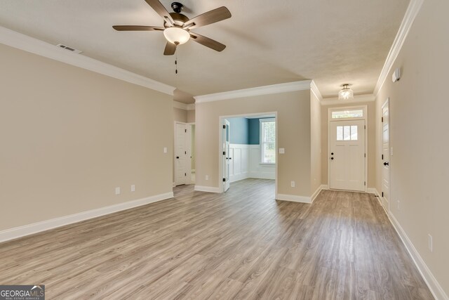 entryway with ceiling fan, light wood-type flooring, and crown molding