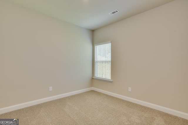 spare room featuring carpet floors