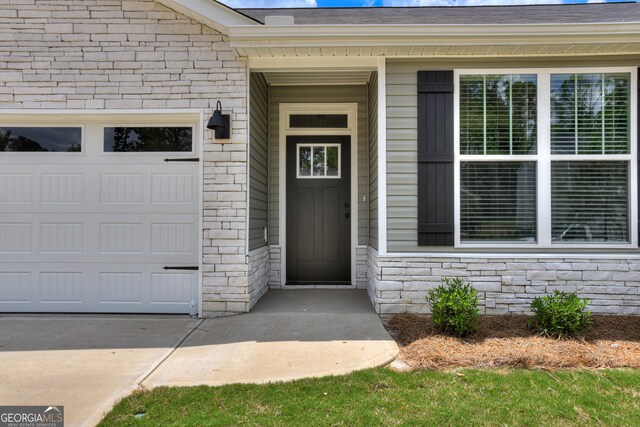 property entrance with a garage