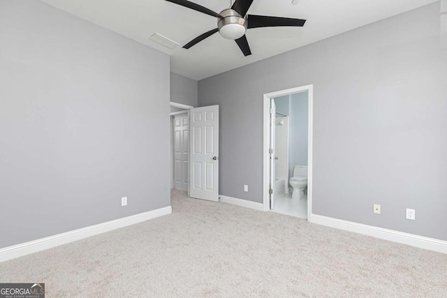 unfurnished bedroom with ensuite bath, ceiling fan, and light colored carpet