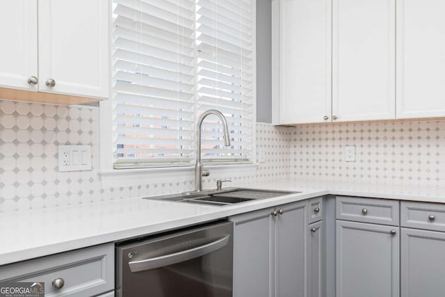 kitchen with decorative backsplash, gray cabinetry, sink, dishwasher, and white cabinetry