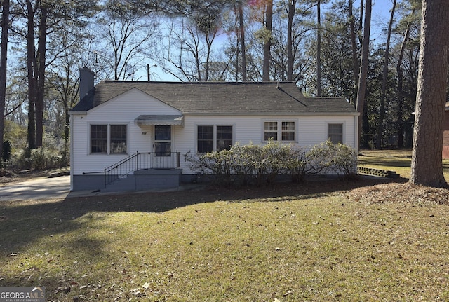 ranch-style house with a front lawn