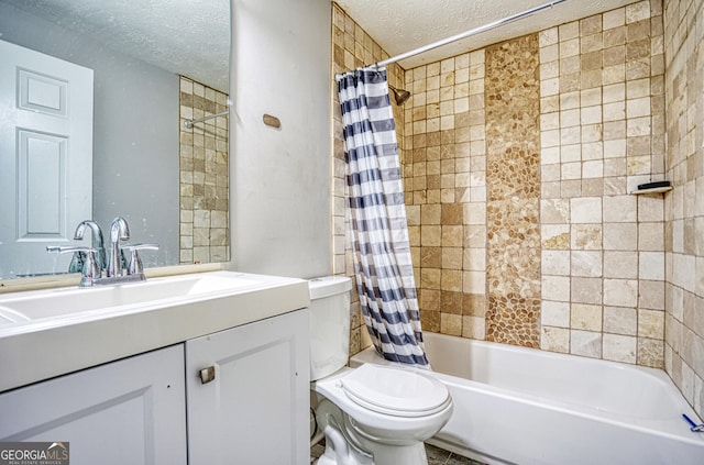 full bathroom featuring vanity, toilet, shower / bath combo with shower curtain, and a textured ceiling