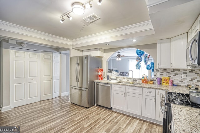 kitchen with white cabinetry, sink, ceiling fan, and stainless steel appliances