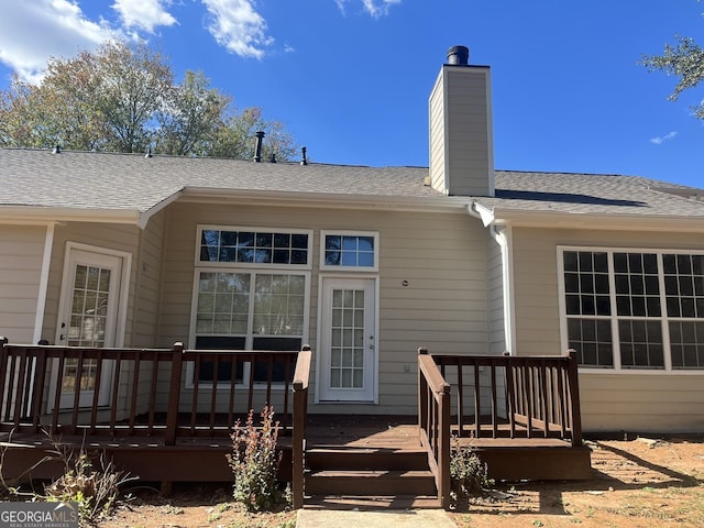 rear view of house with a deck