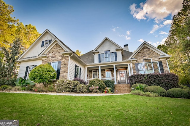 craftsman-style home with a front yard