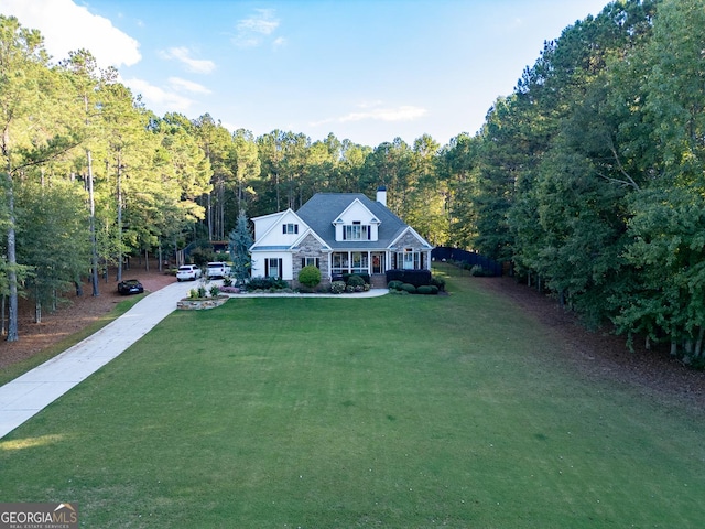 view of front of house featuring a front yard and covered porch