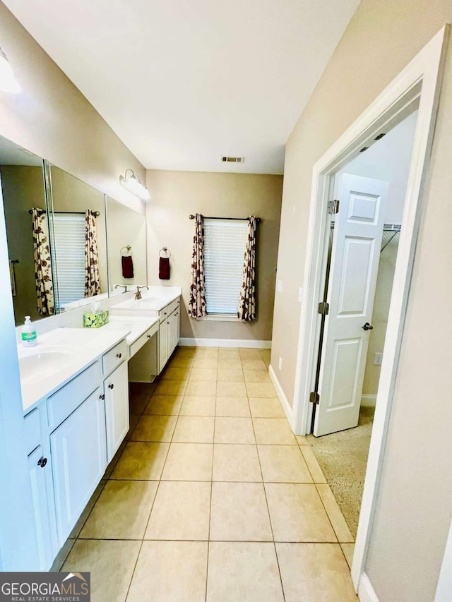 bathroom with vanity and tile patterned floors