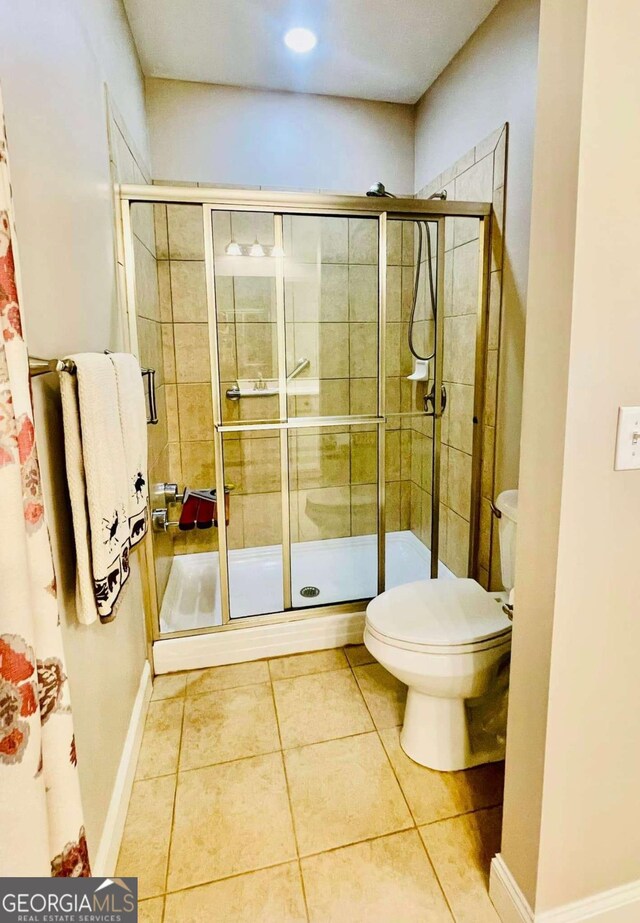 4140 Lanier Ridge Walk Unit 104, Cumming, GA 30041 - bathroom featuring tile patterned flooring and a stall shower
