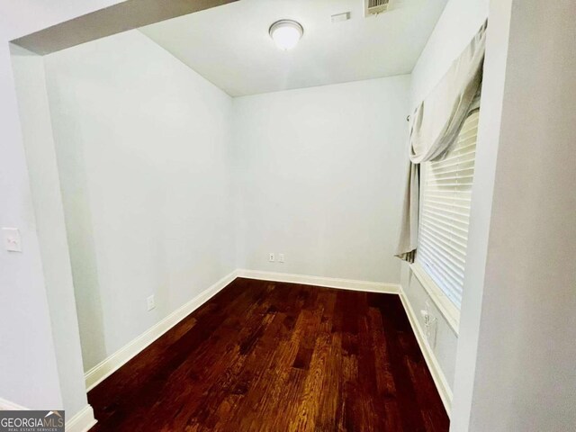 spare room featuring hardwood / wood-style floors