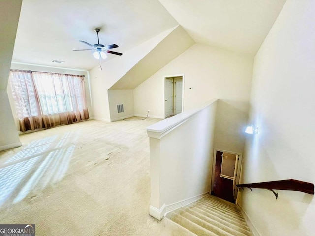 bonus room featuring ceiling fan, light colored carpet, and vaulted ceiling