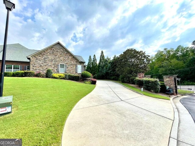 4140 Lanier Ridge Walk Unit 104, Cumming, GA 30041 - view of side of property featuring stone siding