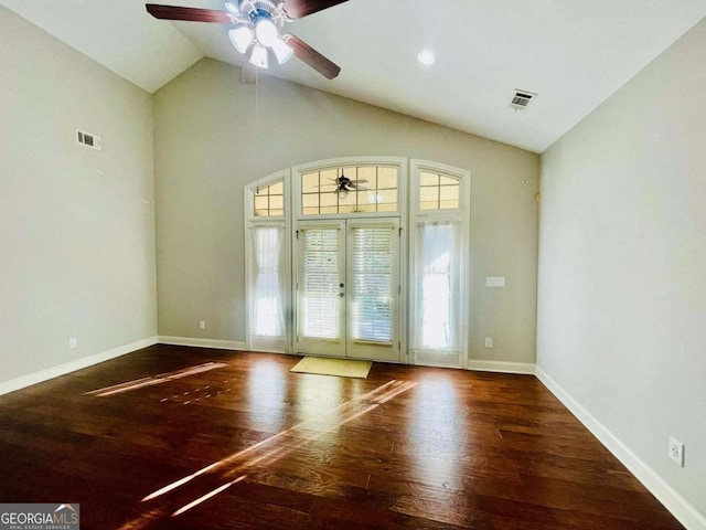 entryway with dark hardwood / wood-style flooring, high vaulted ceiling, french doors, and ceiling fan