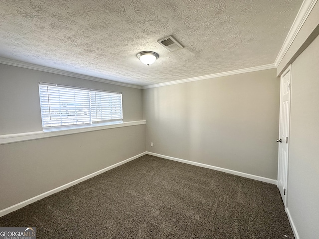 carpeted empty room featuring crown molding and a textured ceiling