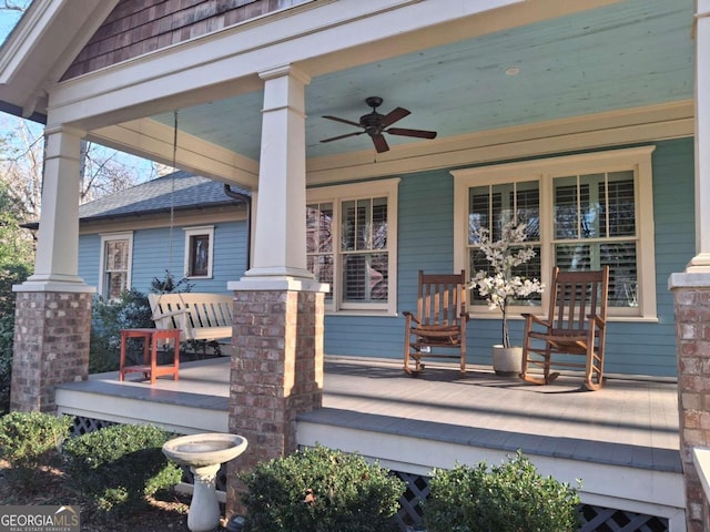 deck featuring ceiling fan and a porch