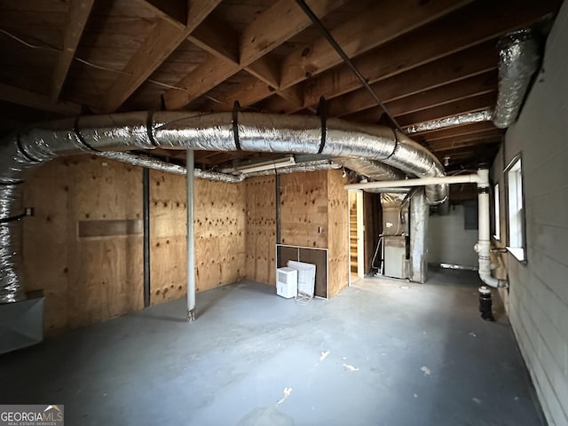 basement featuring heating unit