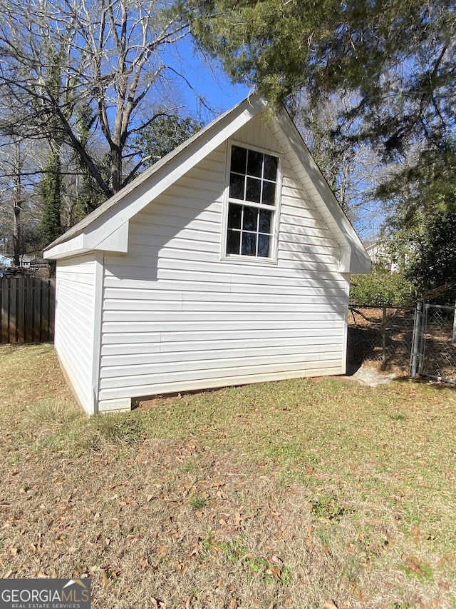 view of side of property with a yard