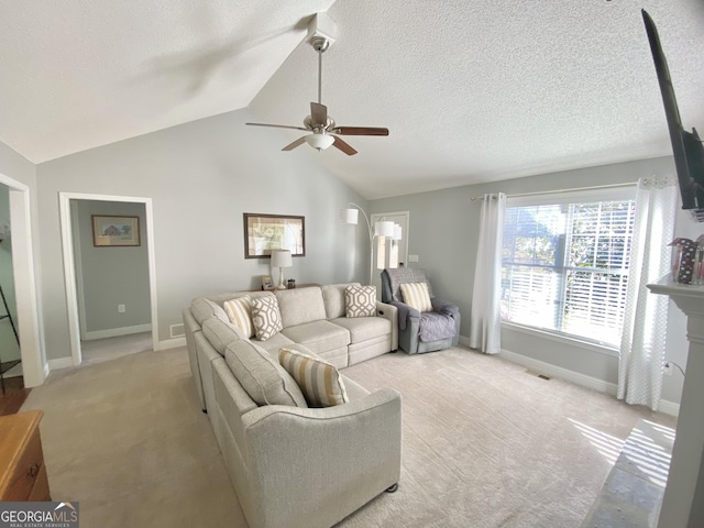 carpeted living room featuring ceiling fan, a textured ceiling, and lofted ceiling