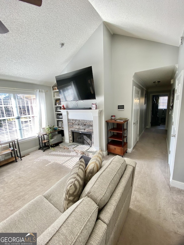 carpeted living room with a textured ceiling and lofted ceiling