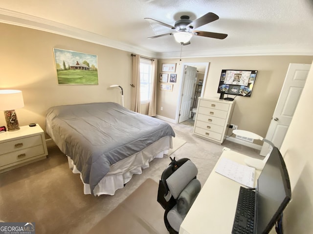 bedroom with ceiling fan, a textured ceiling, and crown molding