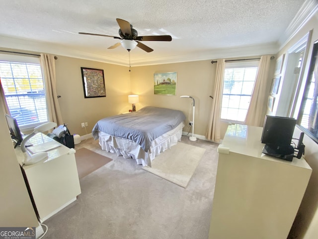 bedroom featuring ceiling fan, light colored carpet, multiple windows, and crown molding