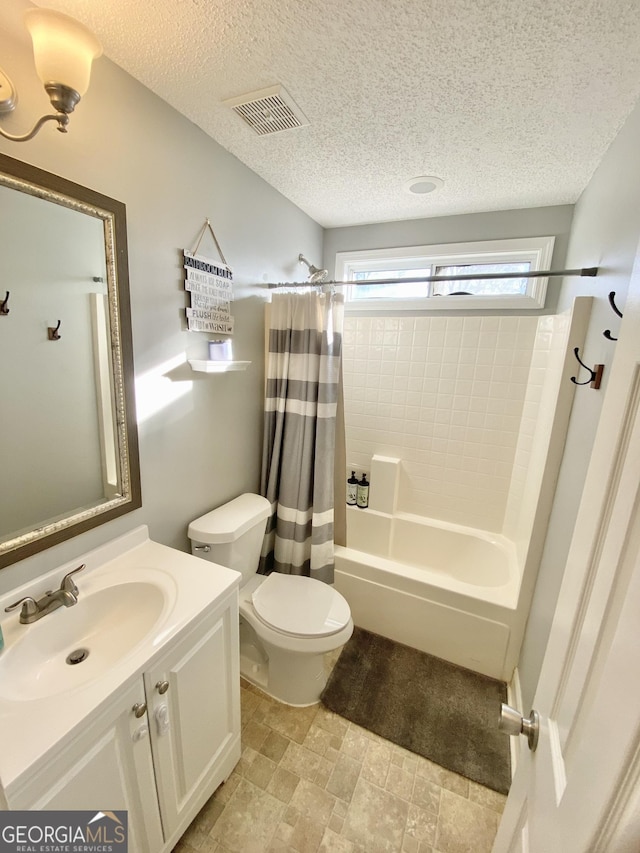 full bathroom featuring a textured ceiling, toilet, vanity, and shower / tub combo