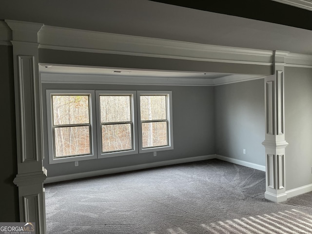 unfurnished living room with ornamental molding and carpet flooring