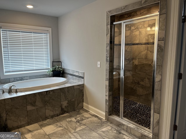 bathroom featuring plus walk in shower